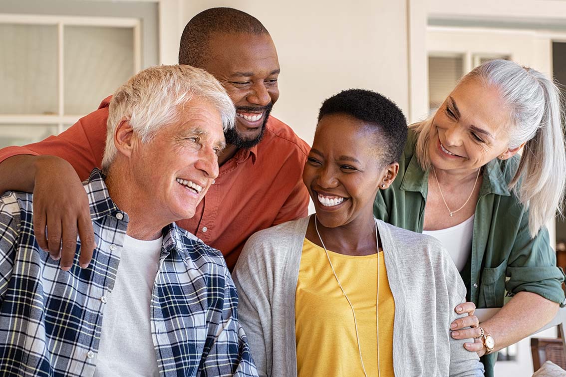 Laughing senior friends with happy women